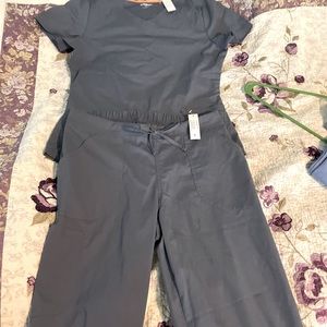 Never worn, light grey, and small size scrubs with soft material!
